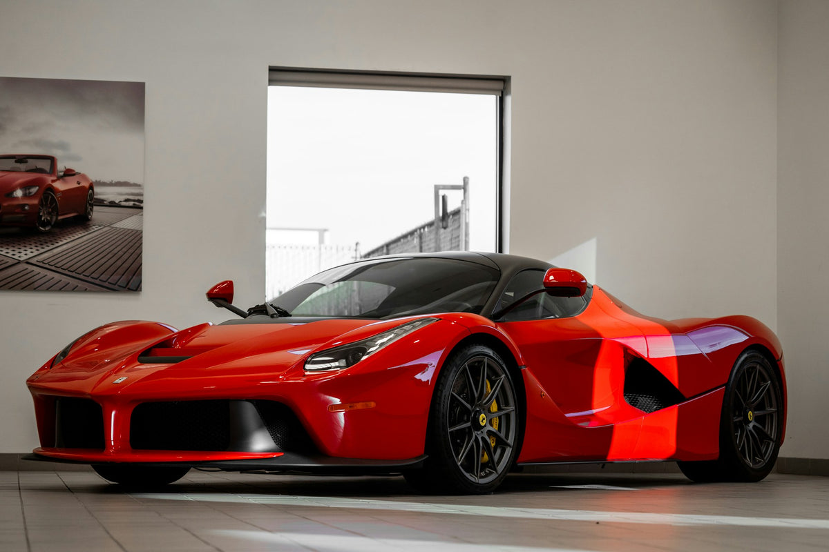 Red Ferrari LaFerrari in a showroom