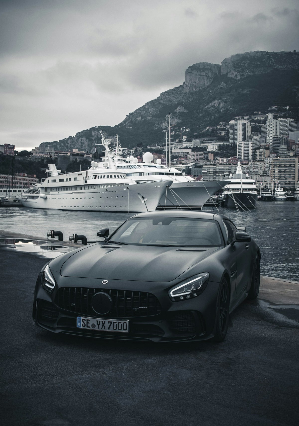 Matte black McLaren on the Monaco harbor quay